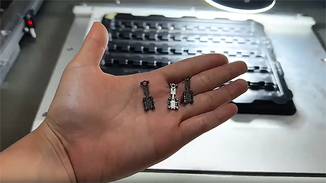 Máquina de inspección de un botón
