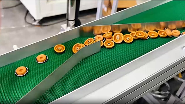 Clasificadora óptica en línea para tapas de botellas